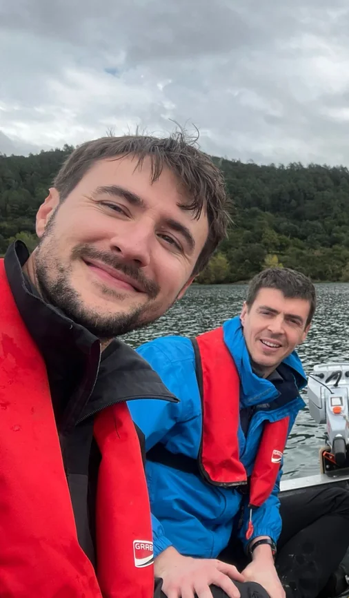 Olivier Evrard on a boat with a colleague during a sampling campaign