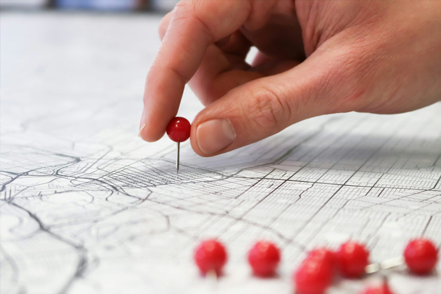 A pin marking a location on a city map, illustrating geographic proximity analysis